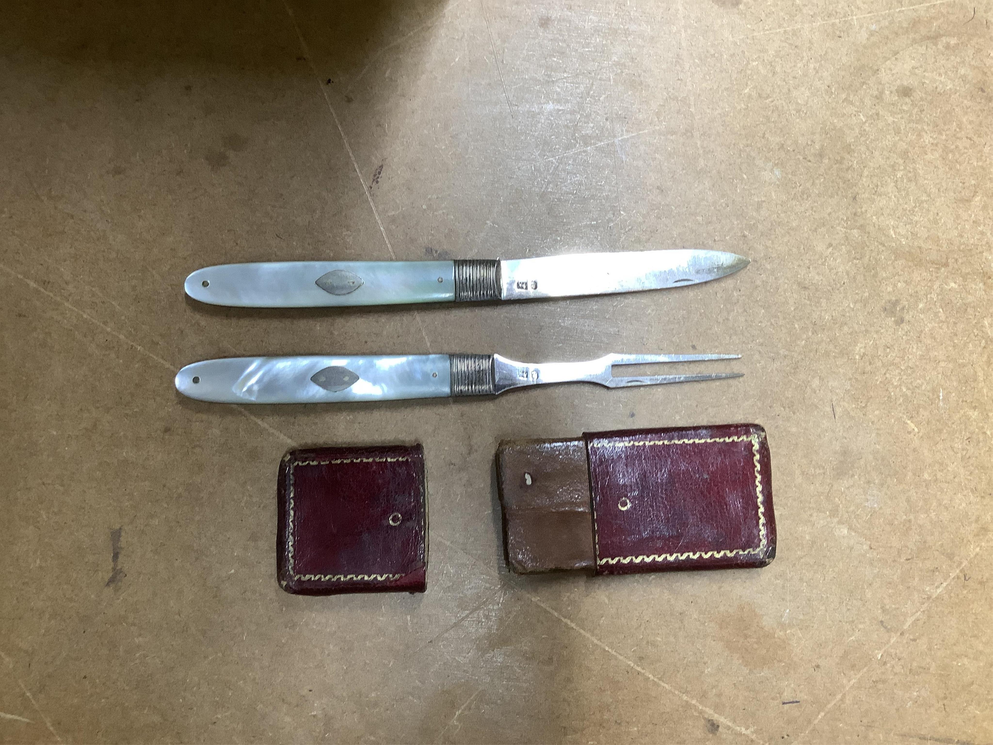 A George V silver mounted glass whisky noggin, by Hukin & Heath, Birmingham, 1911, 10.5cm, together with a Georgian cased mother of pearl handled silver travelling knife and fork set and a cased set of six George VI silv